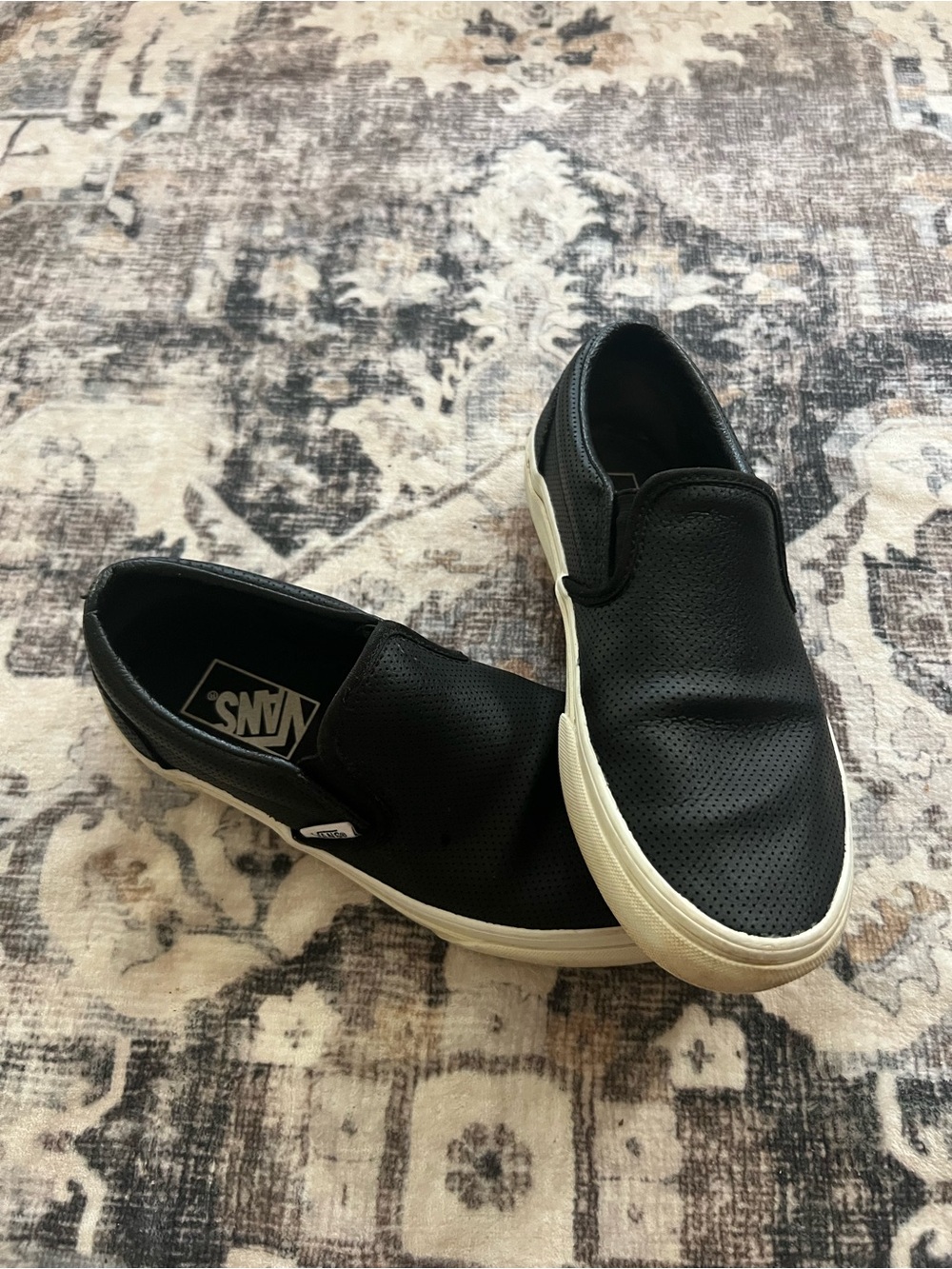 Vans Women’s Slip-On Leather Sneakers in Black